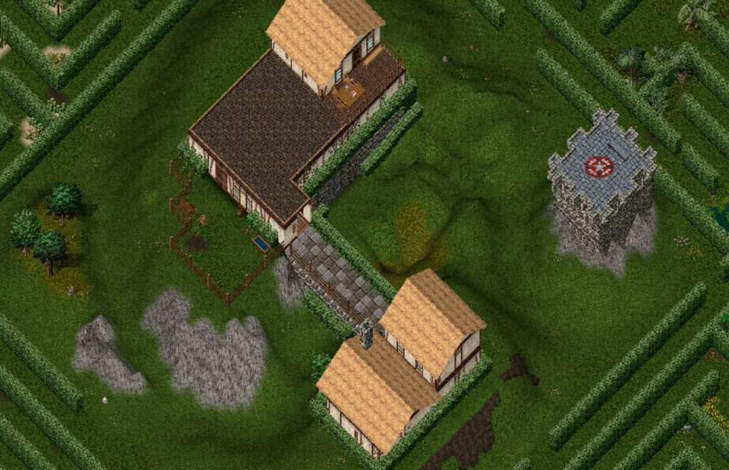 The hedge maze in Ultima Online featuring a farm house cottage, villa, and stone tower structure